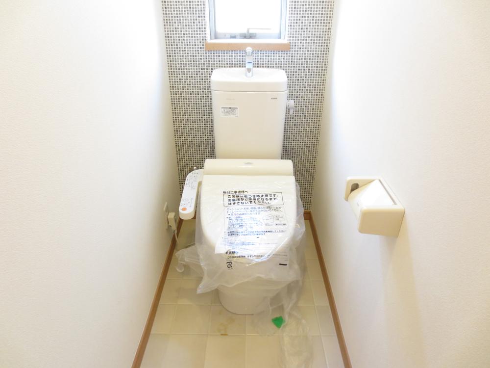 Toilet. Washlet is with