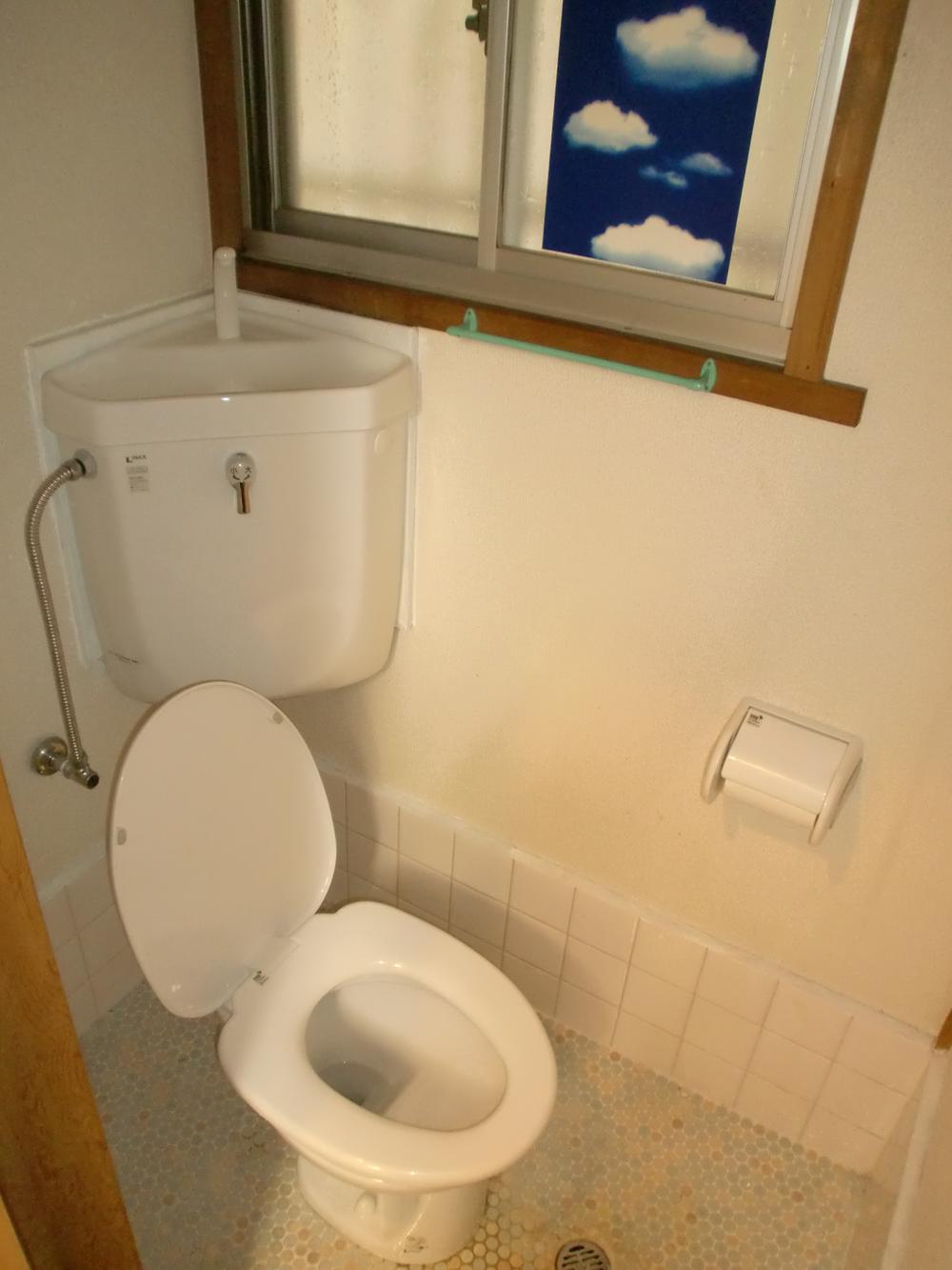 Toilet. Bright toilet with a window.