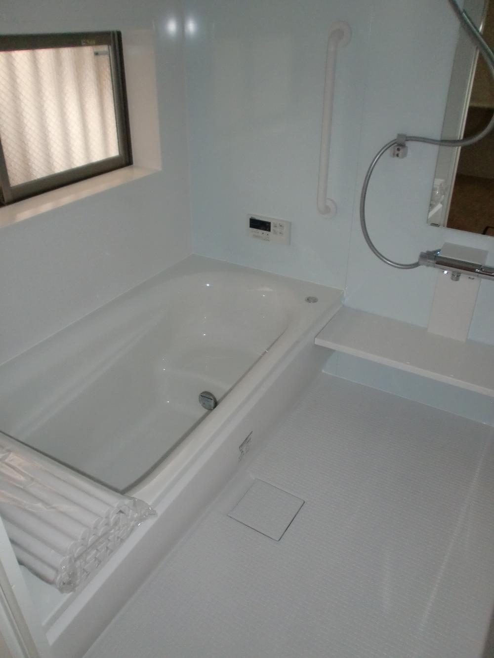 Bathroom. It is with a bathroom dryer. 