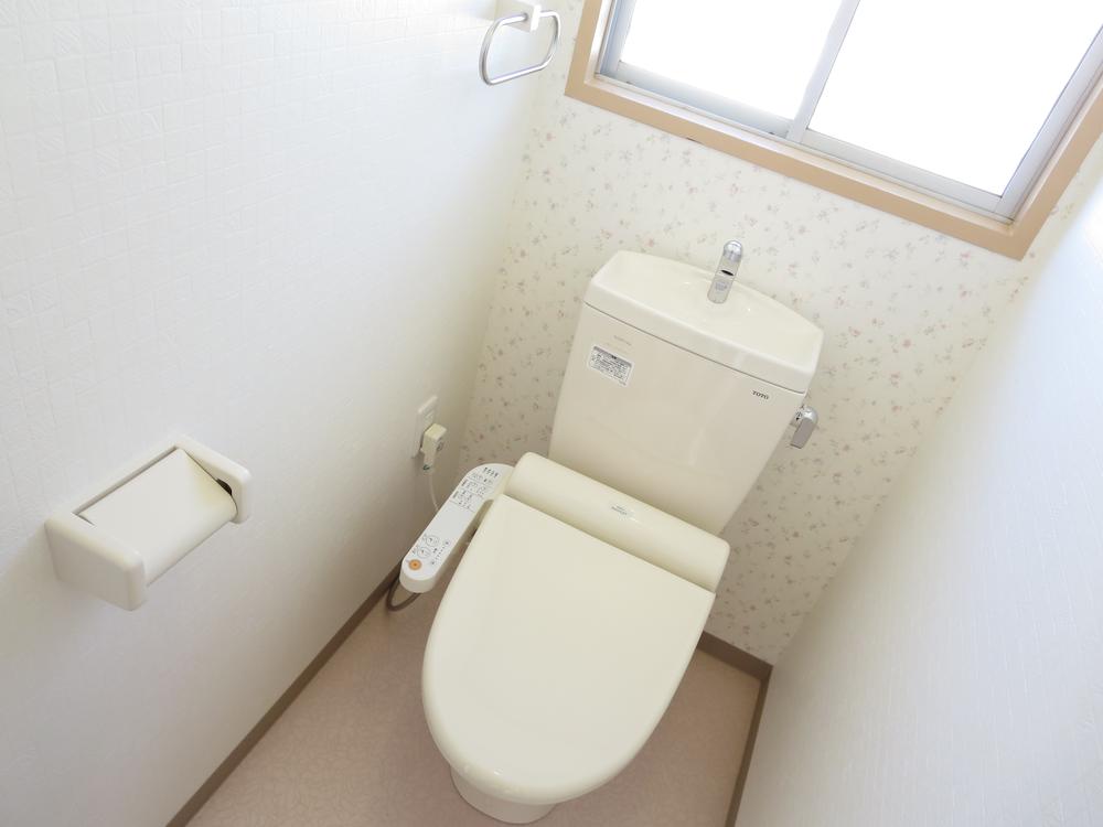 Toilet. TOTO's is of warm water washing toilet seat