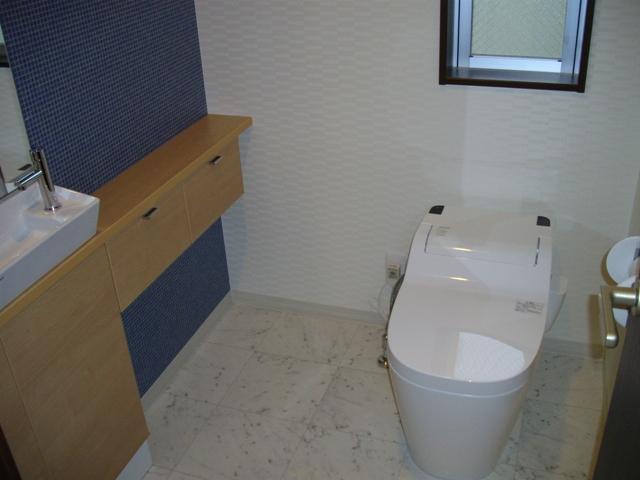 Toilet. Second floor toilet is tankless