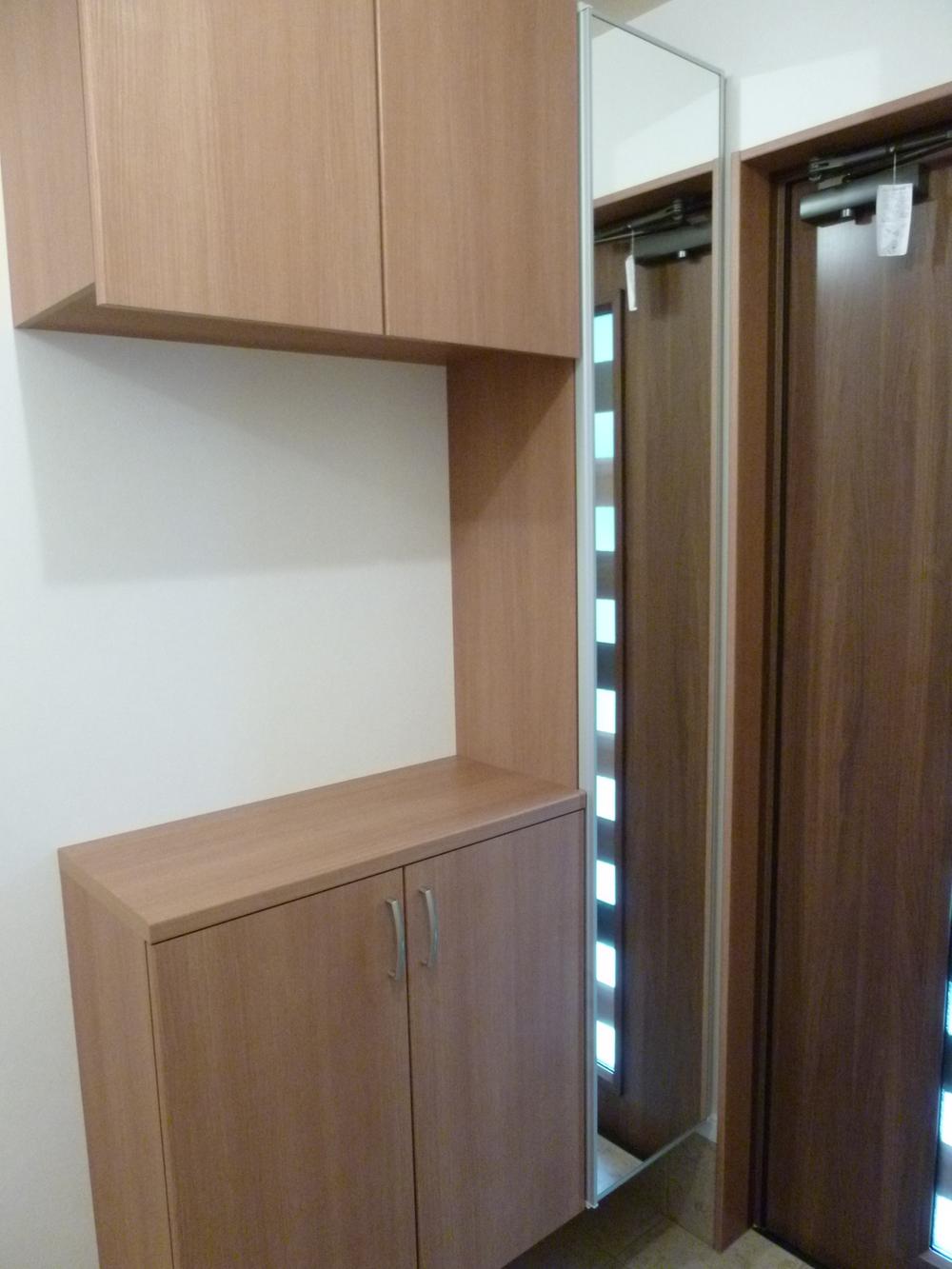 Entrance. Entrance housed with a large mirror