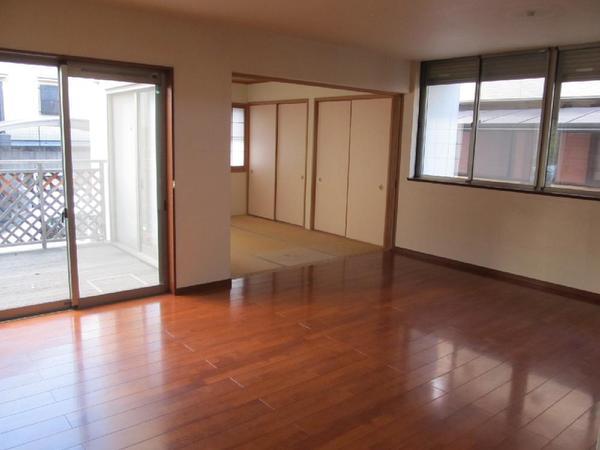 Living. It will be out to the wood deck from the living room.