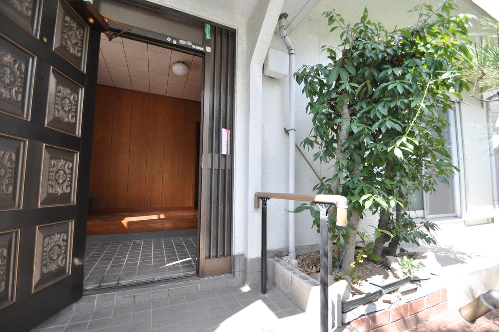 Entrance. It is very lush with pine and flowers on both sides of the entrance portion!