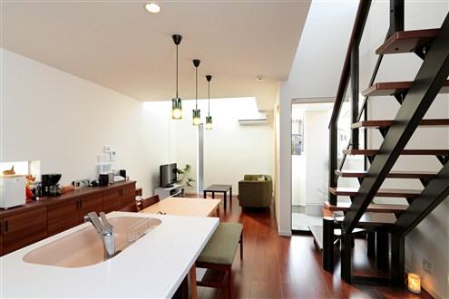 Building plan example (introspection photo).  [Our construction cases] LDK space with depth has become bright in the daylight from the courtyard part. It has become a space that can be without leaving feel the state of the family in the kitchen in the living room in the stairs.