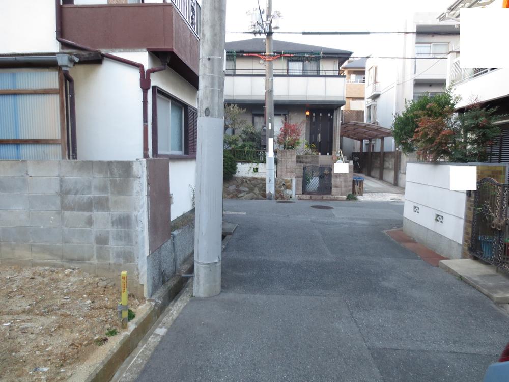 Local photos, including front road. Photo in front of the local 2