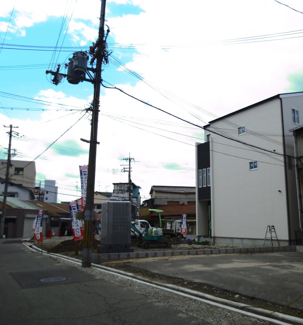 Local photos, including front road. South-facing sunny land