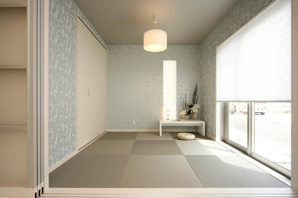 Model house photo. Japanese-style room. You can use the space of the living and integrated by opening the partition.