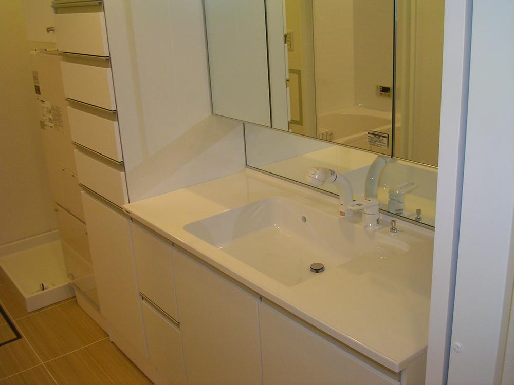 Wash basin, toilet. Vanity had made