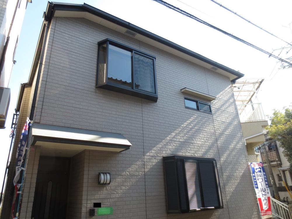 Local appearance photo. Sunny Wooden 2-story