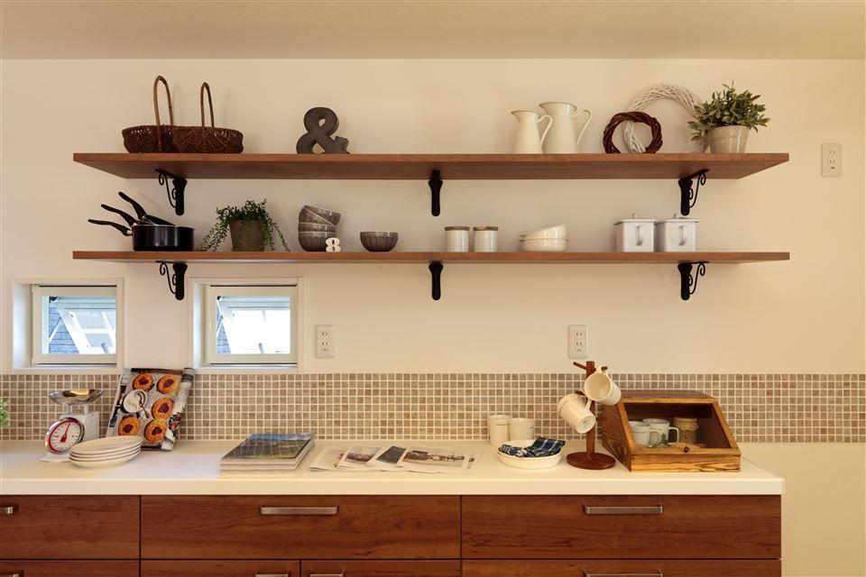 Kitchen. To build the shelves of the kitchen show storage. When you display the tableware and kitchen appliances, which stuck to the material and design, Also it goes up mood.