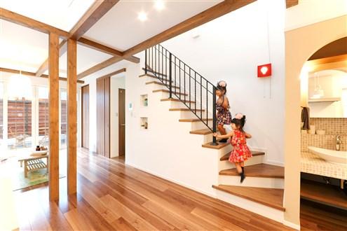 Living. Living-in stairs for us to deepen the ties of family. To accent the two pillars that have me in charge to moderate the living and dining space.