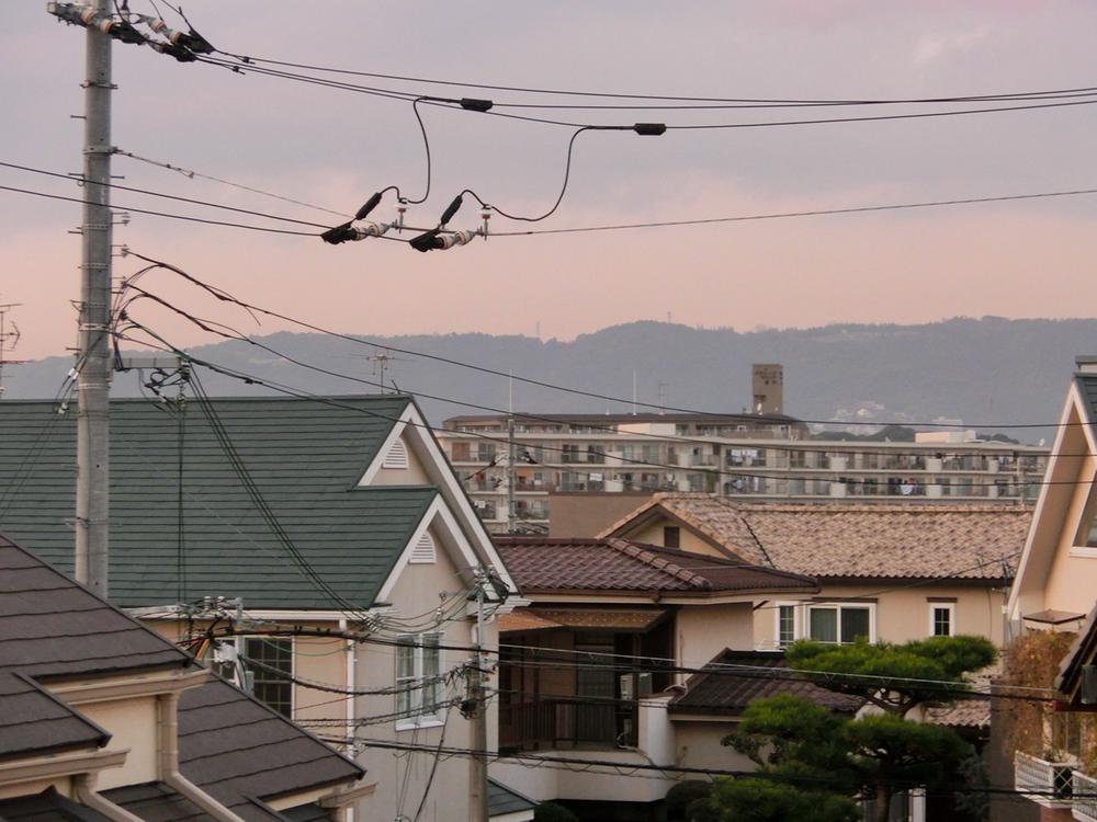 View photos from the dwelling unit. Is the view from the balcony. Around many detached, Looking much is just the roof height.