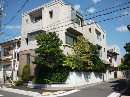 Local appearance photo. The building exterior is a picture taken from the road