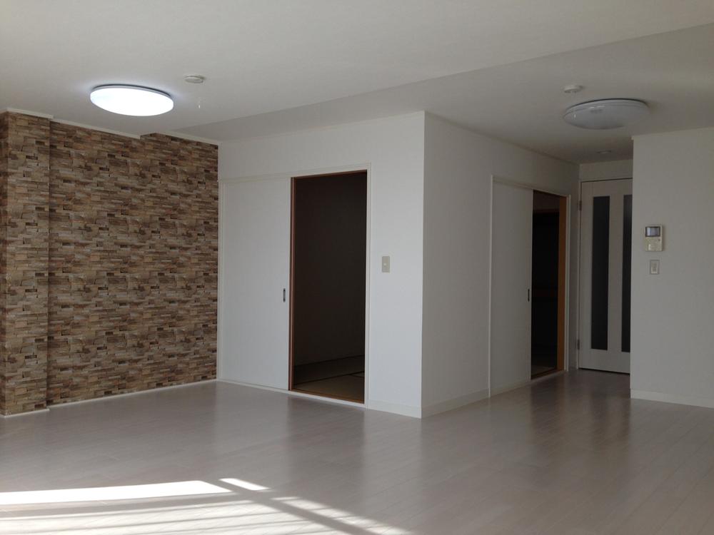 Living. It is a bright living room contains a stylish wall and yang