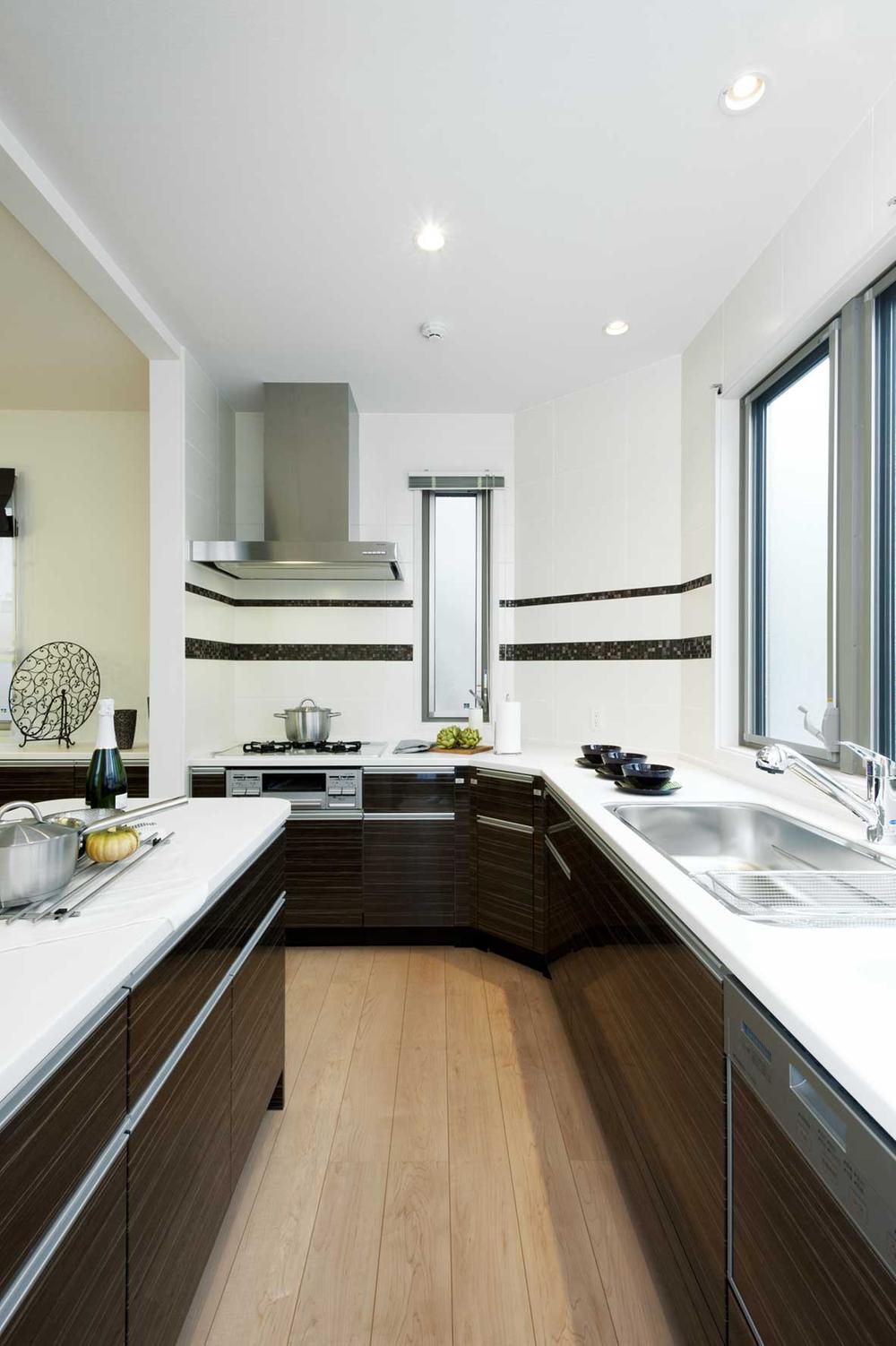 Kitchen facing the large windows. Ensure wide enough to meal preparation of the whole family.