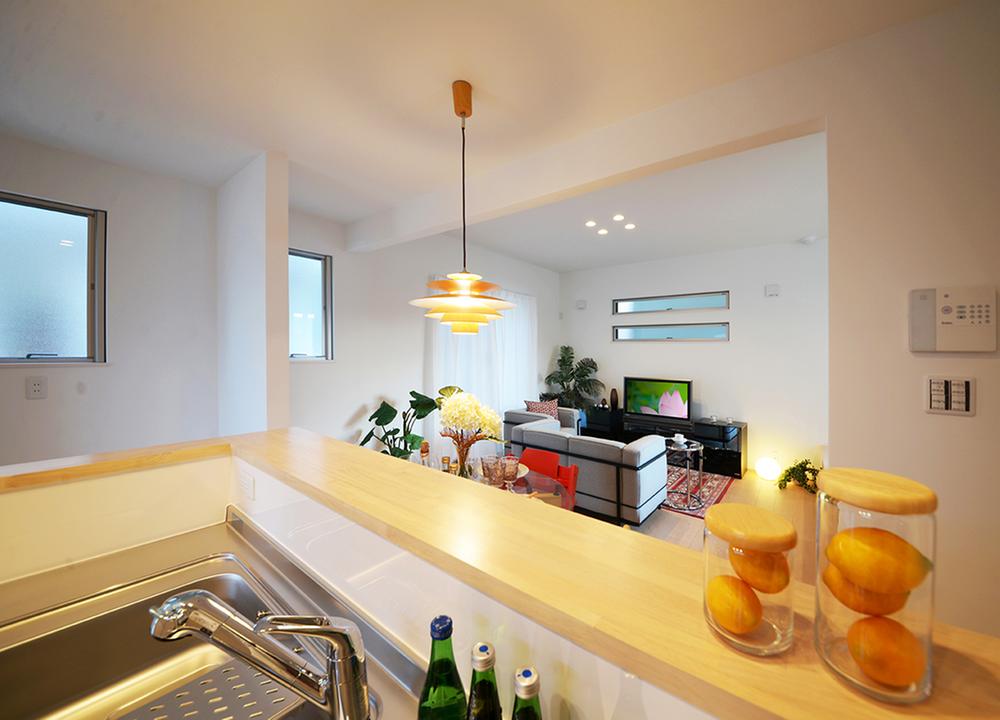 Model house photo. Living room from the kitchen ・ View of dining.