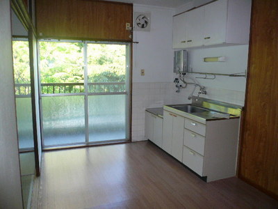 Living and room. Green is visible from the balcony.