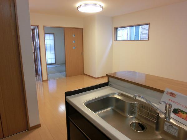 Living. It is safe because the views of the family from the standing position of the kitchen!