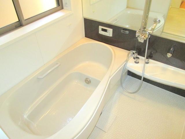 Bathroom. It is a bath full of cleanliness