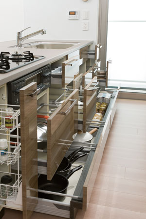Kitchen.  [Sliding storage] Storage of system kitchens, It can be effectively utilized in the prone cabinet in a dead space, It has adopted a sliding storage.