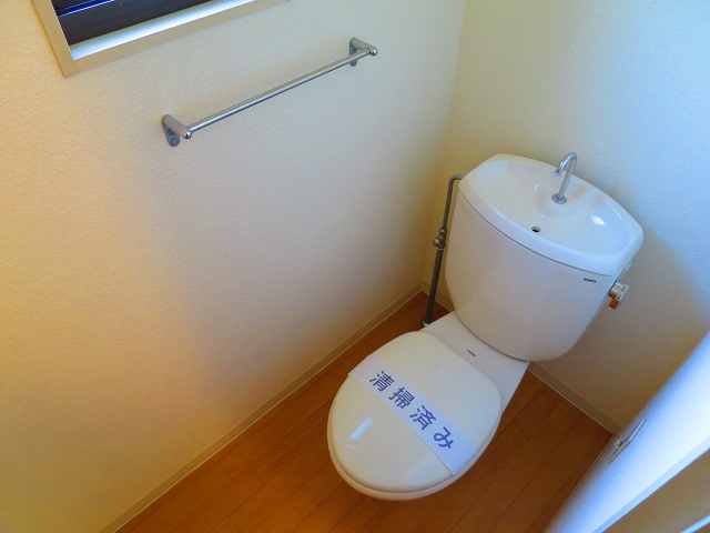 Toilet. There is a small window