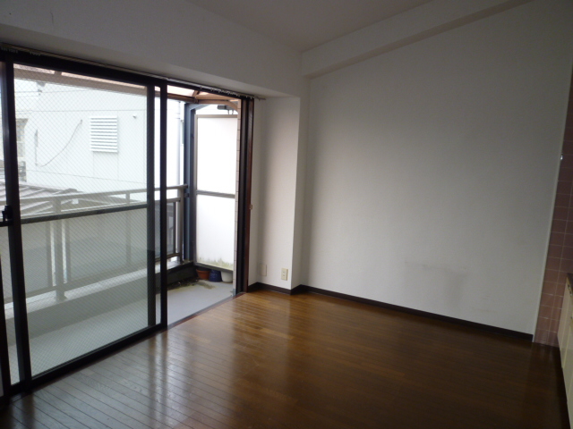 Living and room. It is a photograph of another room