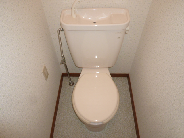 Toilet. Same property, It is a photograph of another room