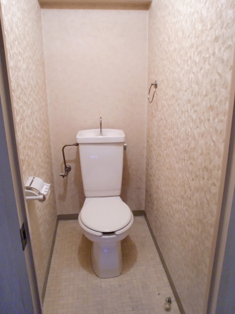 Toilet. The same is by Property of the room