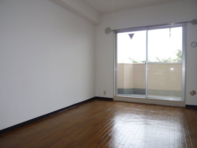 Living and room. It is a photograph of another room.