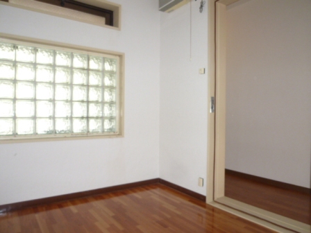 Other room space. It is a photograph of another in Room