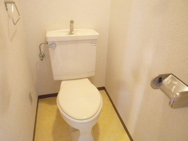 Toilet. Same property, It is a photograph of another room