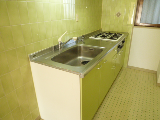 Kitchen. It is a photograph of another room of the same type.