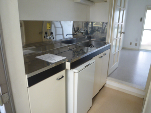 Kitchen. It is a photograph of the room in a separate building