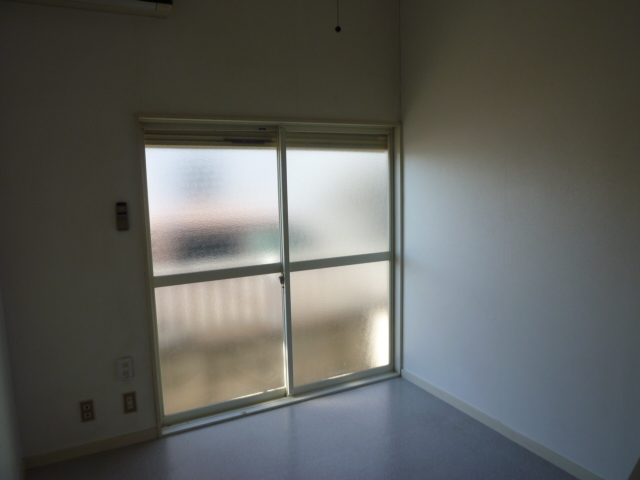 Other room space. It is a photograph of the room in a separate building