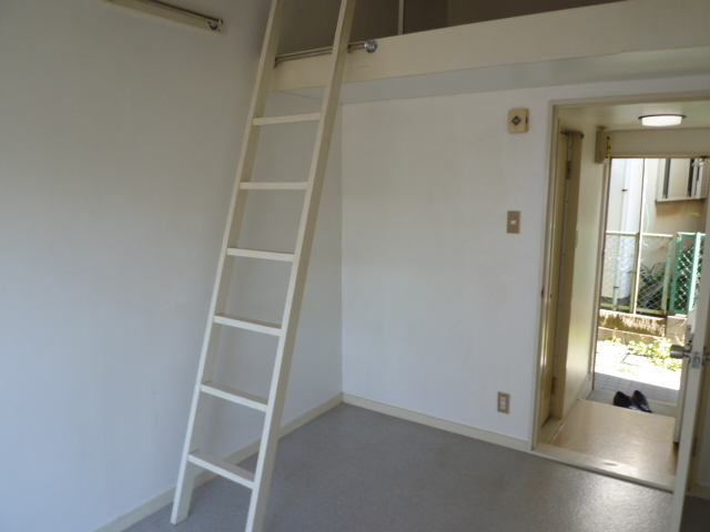 Living and room. It is a photograph of the room in a separate building