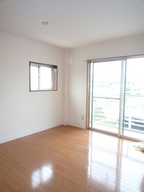 Living and room. Corner room. There is a window to the side. 