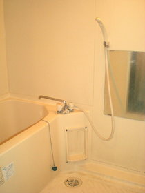 Bath. Is a bathroom that has been unified with white