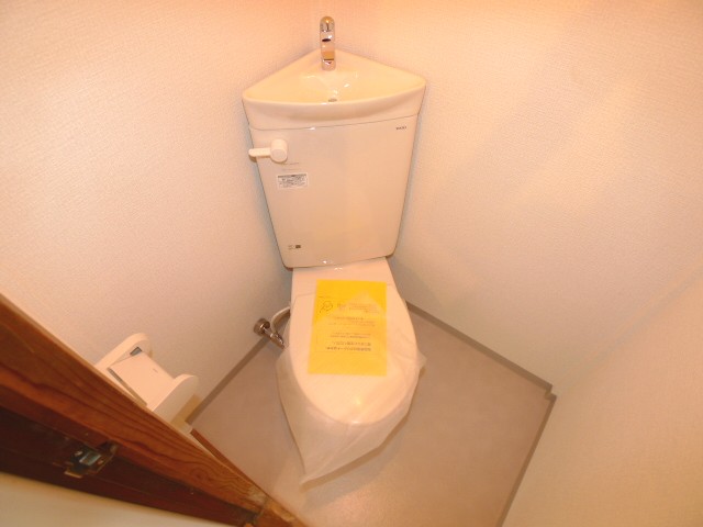 Toilet. There is also a window with a new toilet