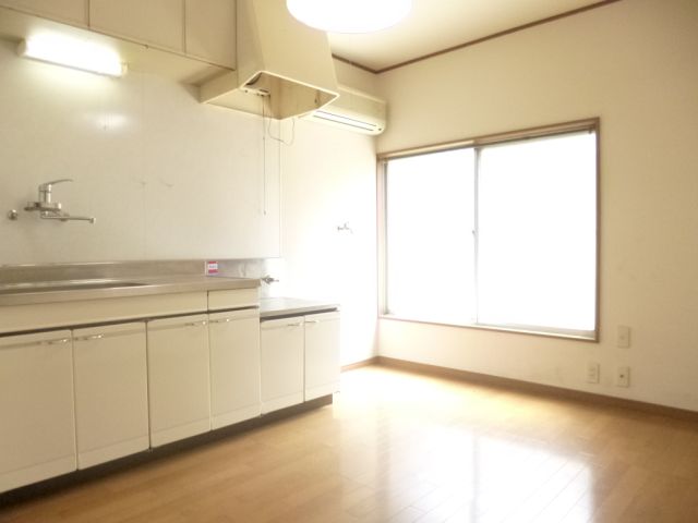 Kitchen. It is bright because the large windows in the kitchen