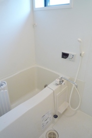 Bath. There is also a window.