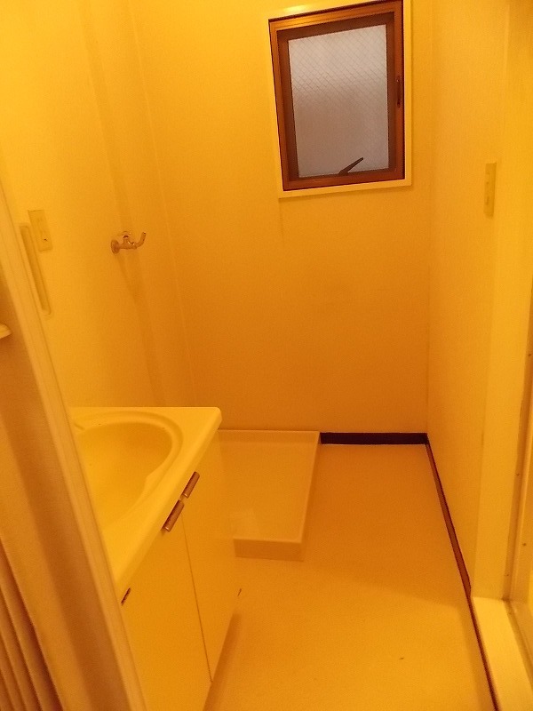 Other Equipment. Dressing room, Washing machine in the room. It has a window. 