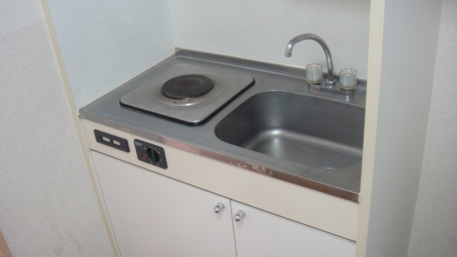 Kitchen. It is an electric stove in the kitchen.