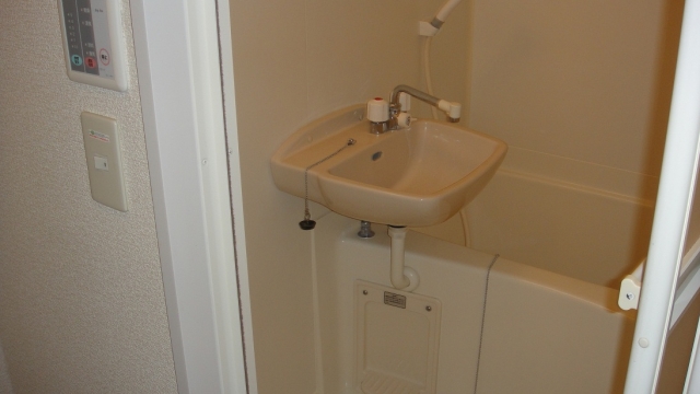 Bath. It is a bathroom with a shower. With bathroom ventilation dryer.