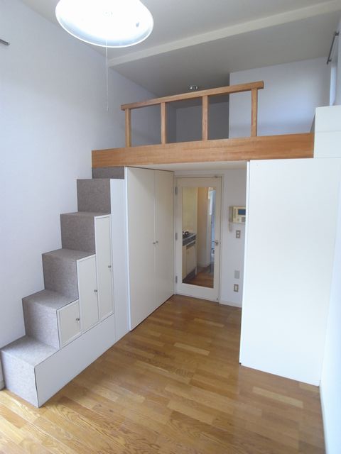 Living and room. Stairs under the small and storage space