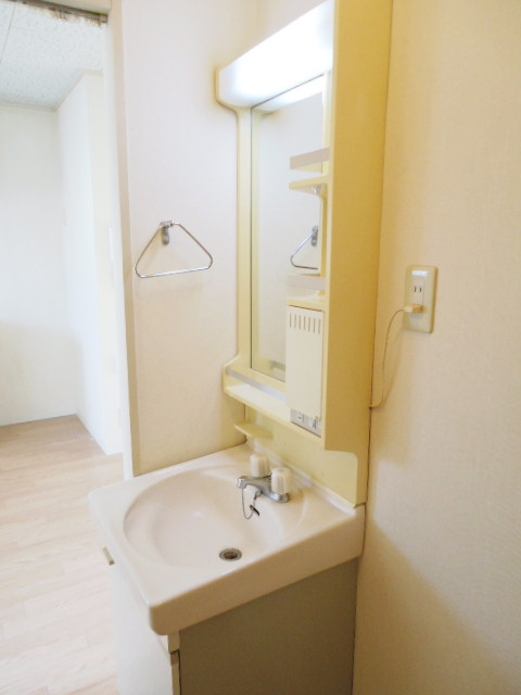 Washroom. In front of the faucet is for the washing machine. 