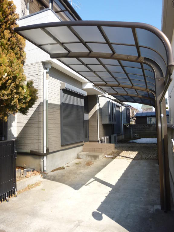 Parking lot. Carport with a roof! You can park two by size