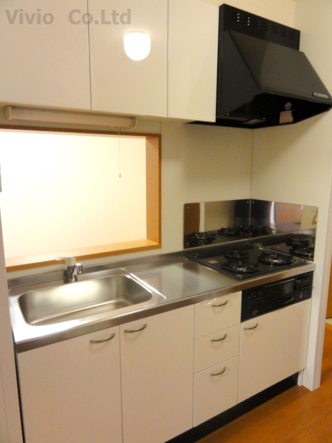 Kitchen. 3-burner stove, There are many kitchen storage.