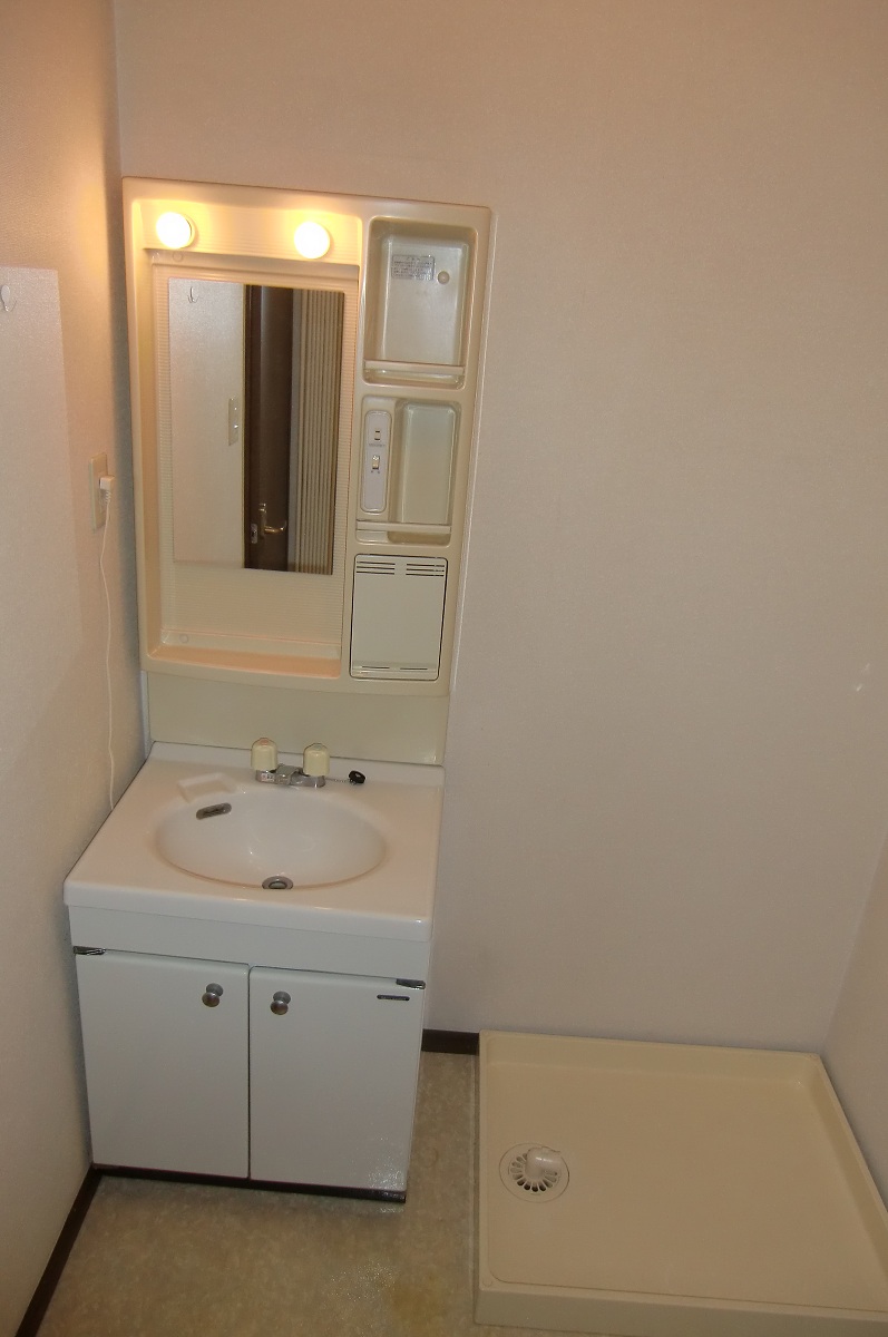 Washroom. Washing machine in the room