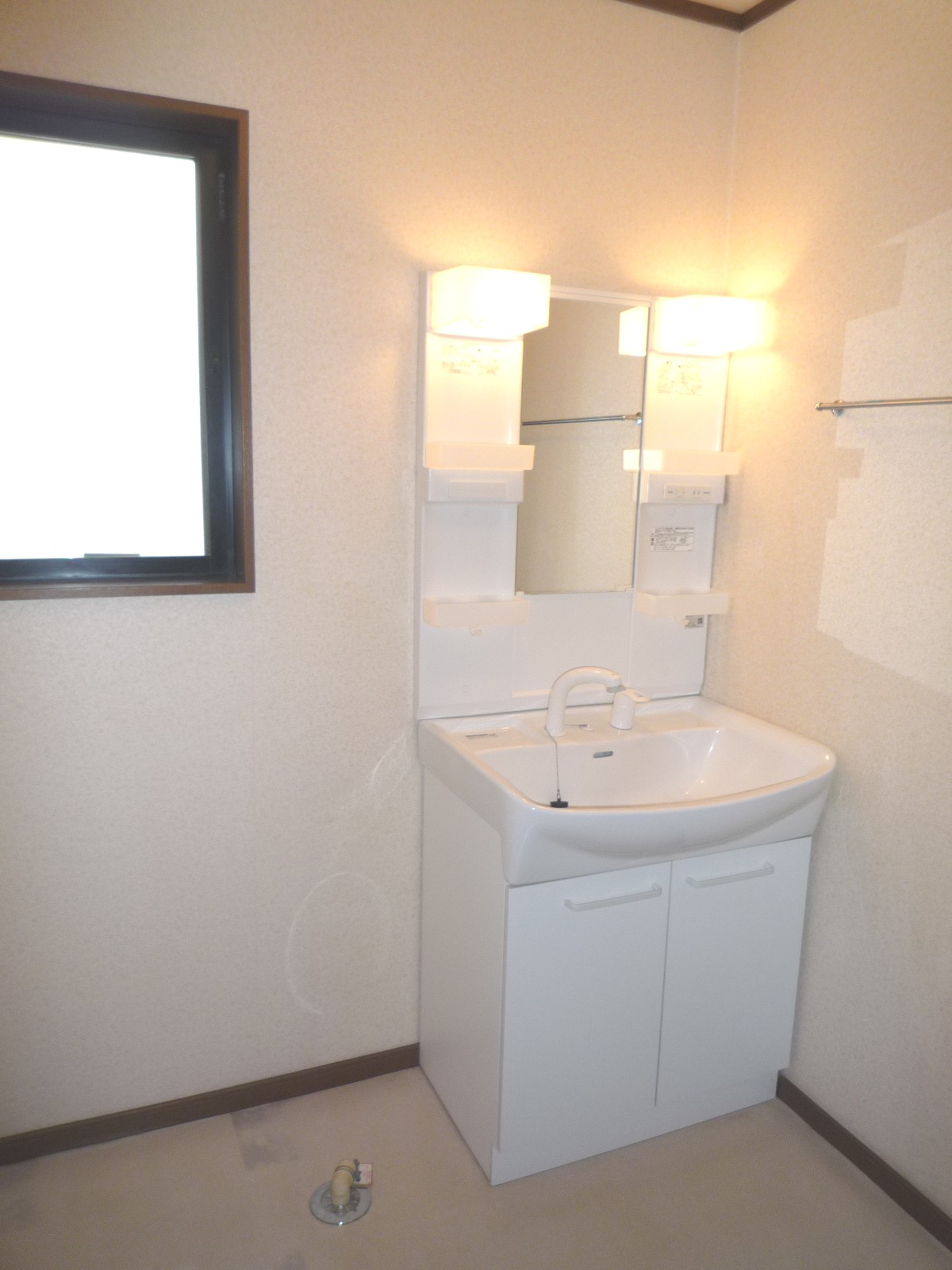 Washroom. It is a wash room with a window.